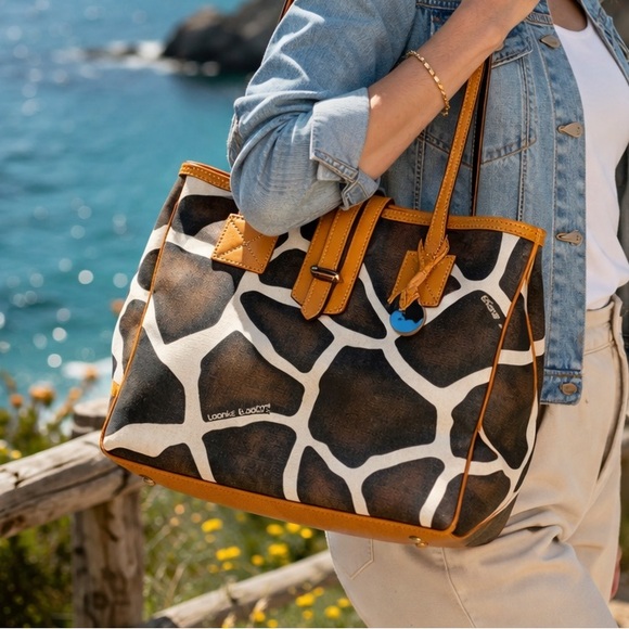 Dooney & Bourke Handbags - DOONEY & BOURKE VINTAGE GIRAFFE ANIMAL.. CANVAS W/ TAN LEATHER TRIM DUCK CHARM